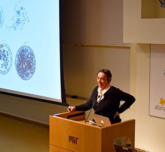 Angelika Amon speaks at a podium